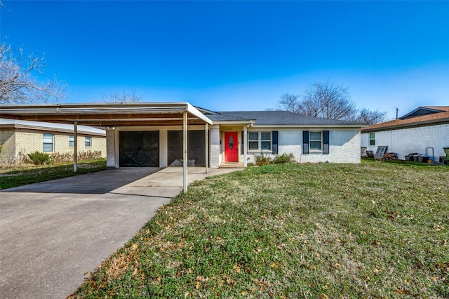 ranch-style house with a carport and a front lawn