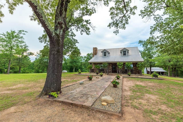 view of front facade with covered porch and a front yard