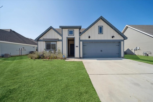 modern farmhouse featuring a garage and a front yard