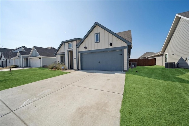 modern inspired farmhouse featuring a front lawn, board and batten siding, central AC, and driveway