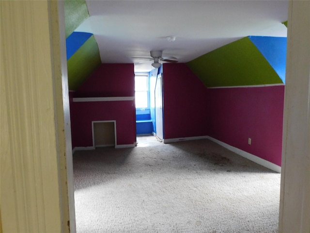 bonus room featuring ceiling fan, lofted ceiling, and carpet floors