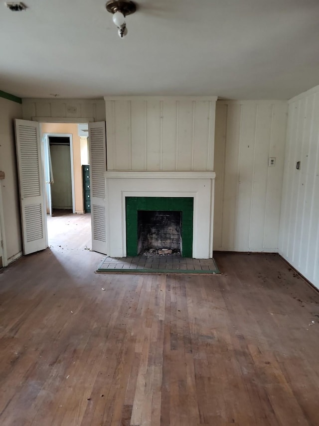 unfurnished living room featuring wood-type flooring