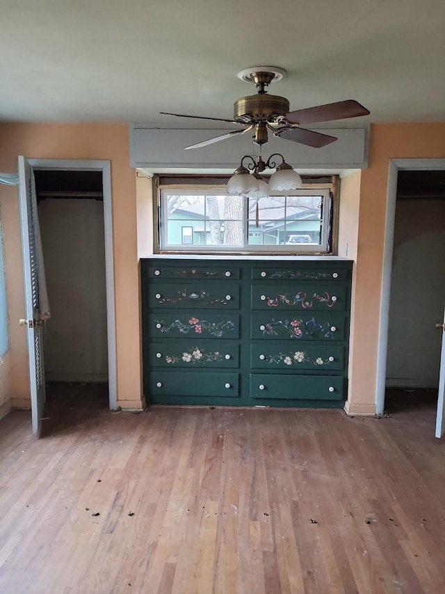 unfurnished bedroom featuring ceiling fan and wood-type flooring