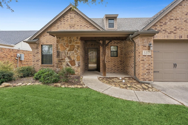 view of front of house with roof with shingles, brick siding, a front lawn, and an attached garage