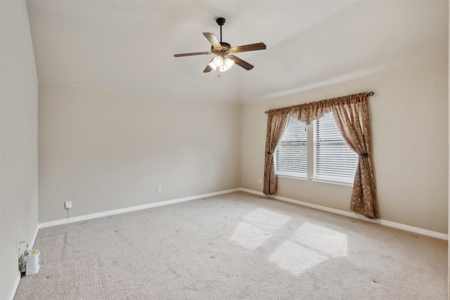 unfurnished room featuring light colored carpet and ceiling fan