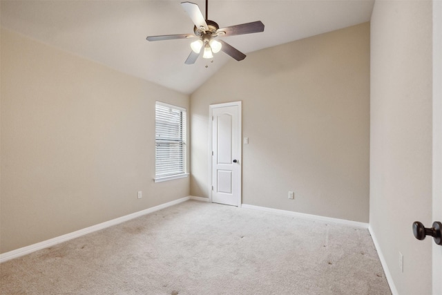 unfurnished room featuring vaulted ceiling, light colored carpet, and ceiling fan