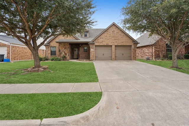 view of front of home featuring brick siding, a garage, concrete driveway, a front yard, and roof with shingles