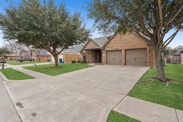 ranch-style house with a garage, central air condition unit, and a front lawn