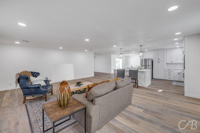 living room with light hardwood / wood-style floors