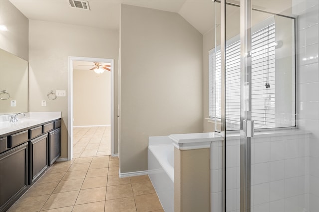 bathroom featuring vaulted ceiling, vanity, independent shower and bath, ceiling fan, and tile patterned flooring