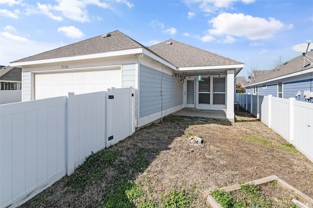 exterior space with a garage