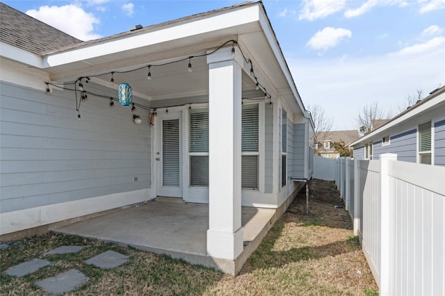 view of side of home with a patio