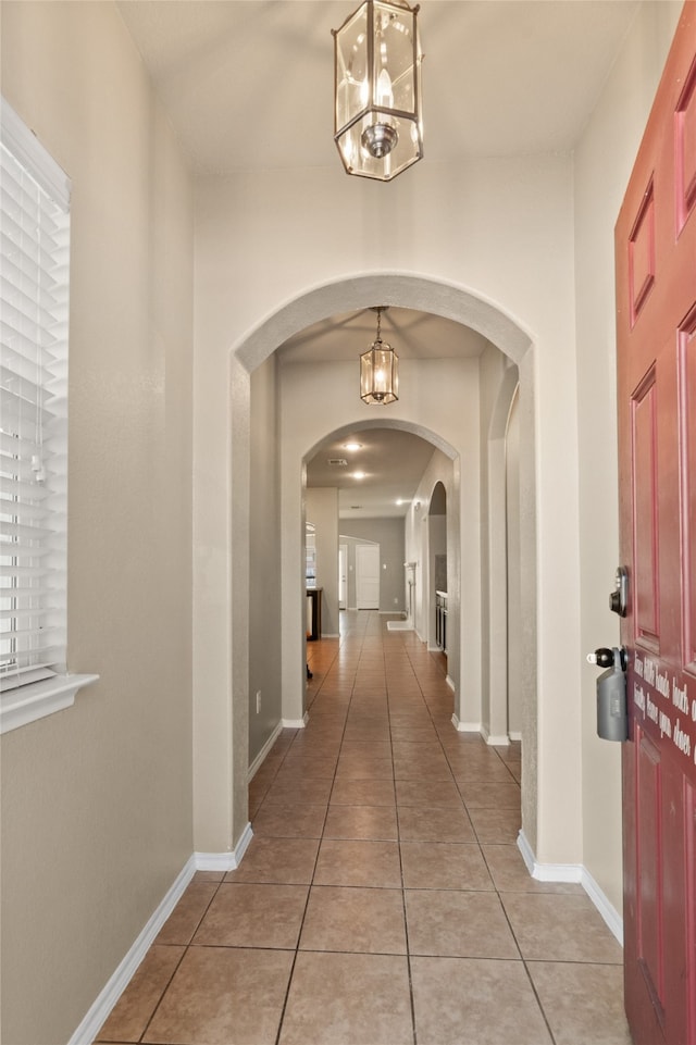 corridor featuring light tile patterned floors