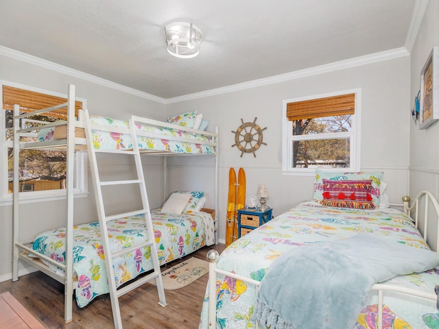 bedroom featuring hardwood / wood-style flooring and crown molding