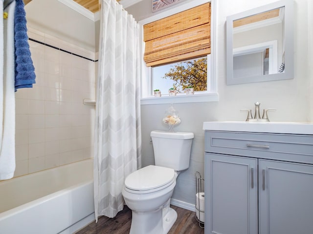 full bathroom featuring hardwood / wood-style flooring, crown molding, shower / tub combo, and vanity