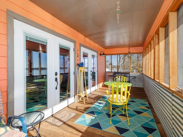 unfurnished sunroom featuring french doors and wooden ceiling