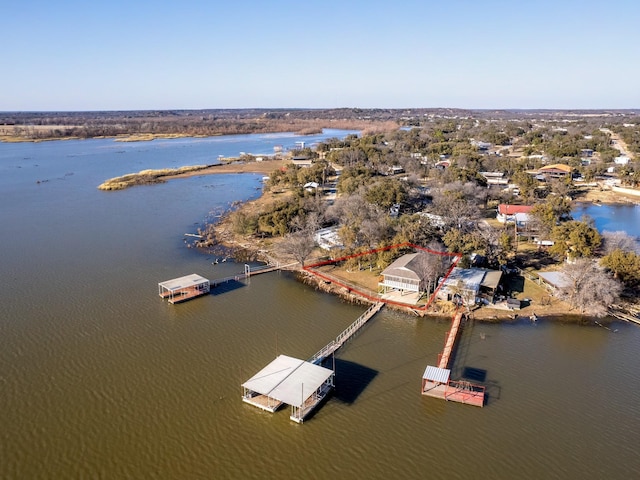 drone / aerial view with a water view