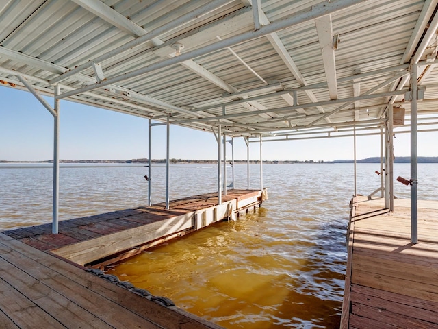 dock area with a water view