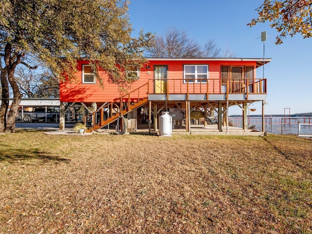 back of property featuring a lawn