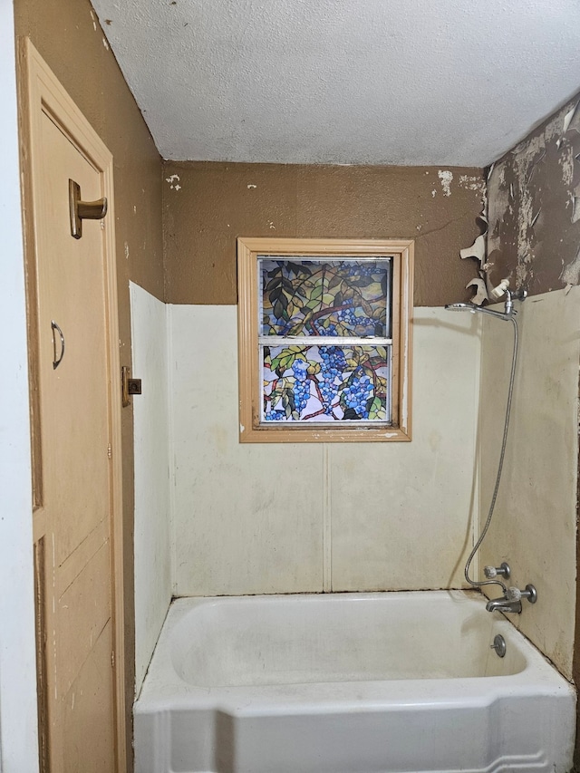 bathroom featuring a textured ceiling