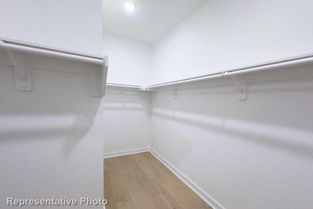 1250 Falls Rush Way, Royse City, TX 75189 - spacious closet with light hardwood / wood-style floors