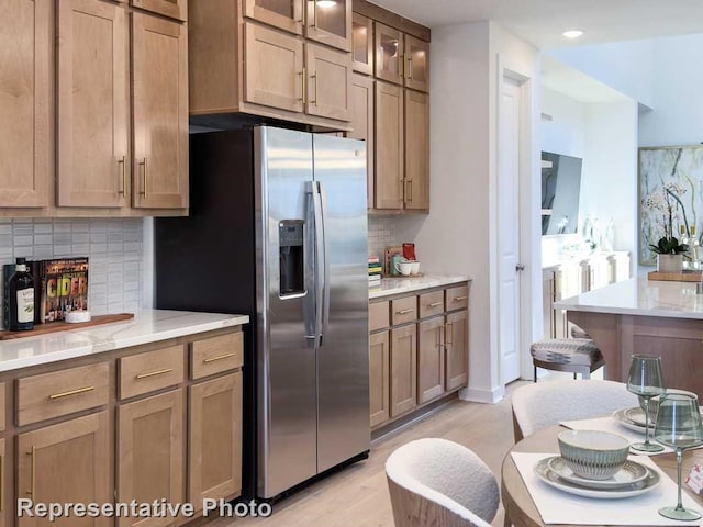 1250 Falls Rush Way, Royse City, TX 75189 - kitchen with tasteful backsplash, stainless steel refrigerator with ice dispenser, light stone counters, and light hardwood / wood-style flooring