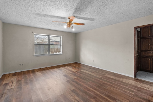 unfurnished room with a textured ceiling, dark hardwood / wood-style floors, and ceiling fan