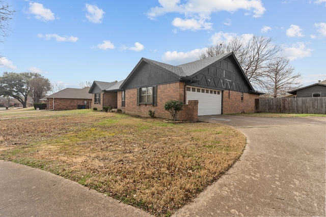 view of front of home with a garage and a front yard