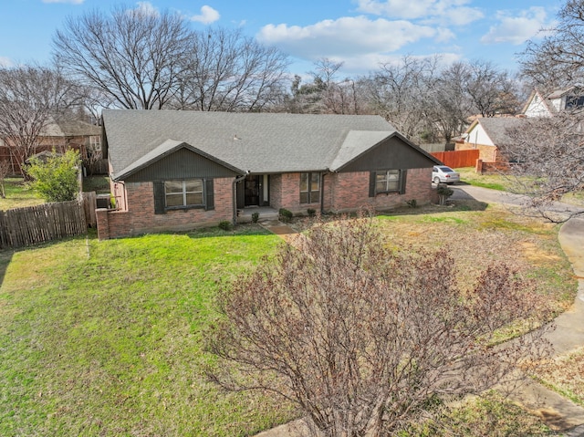 ranch-style home with a front lawn