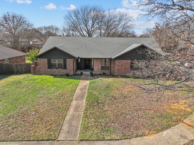 ranch-style home with a front lawn