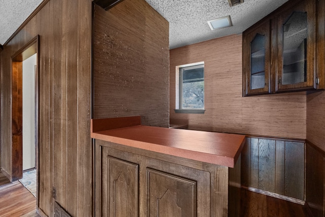 interior space with light hardwood / wood-style floors and a textured ceiling