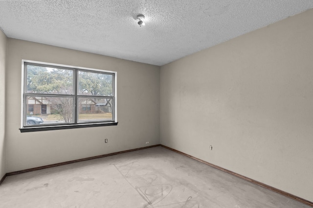 spare room featuring a textured ceiling