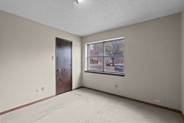 unfurnished bedroom with a textured ceiling