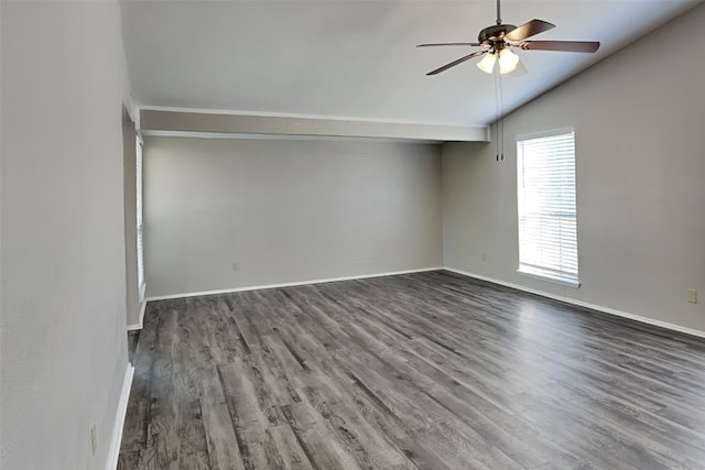 empty room featuring lofted ceiling, dark hardwood / wood-style floors, and ceiling fan