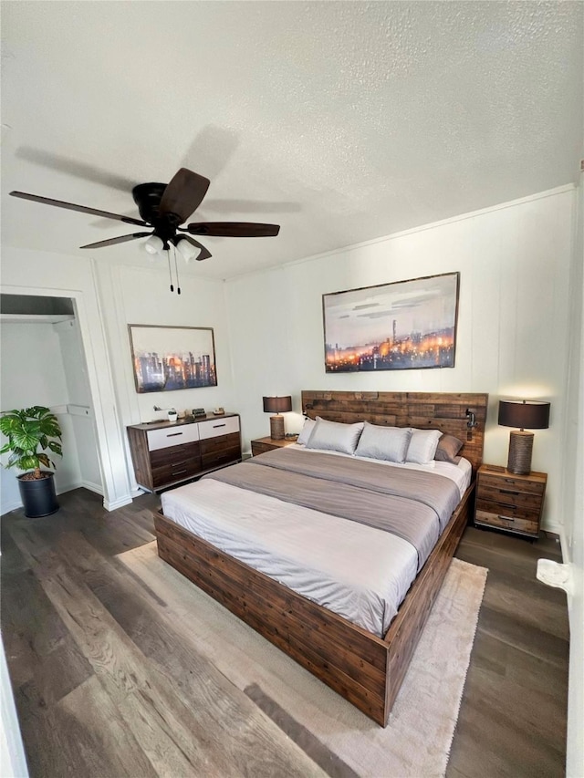 304 Lockwood St, White Settlement, TX 76108 - bedroom featuring dark wood-type flooring, a textured ceiling, and ceiling fan