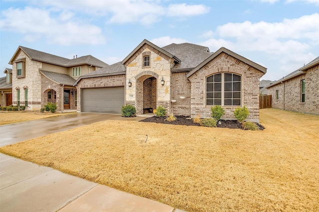 french provincial home featuring a garage