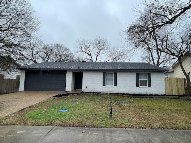 single story home with a garage and a front yard