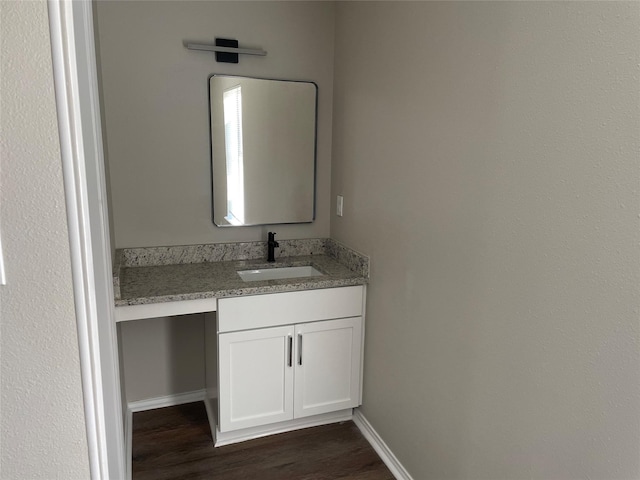 bathroom with vanity and wood-type flooring