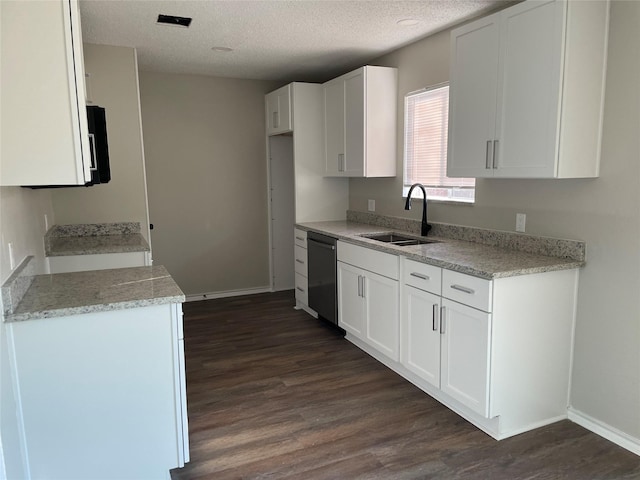 kitchen with white cabinetry, dark hardwood / wood-style flooring, black dishwasher, and sink