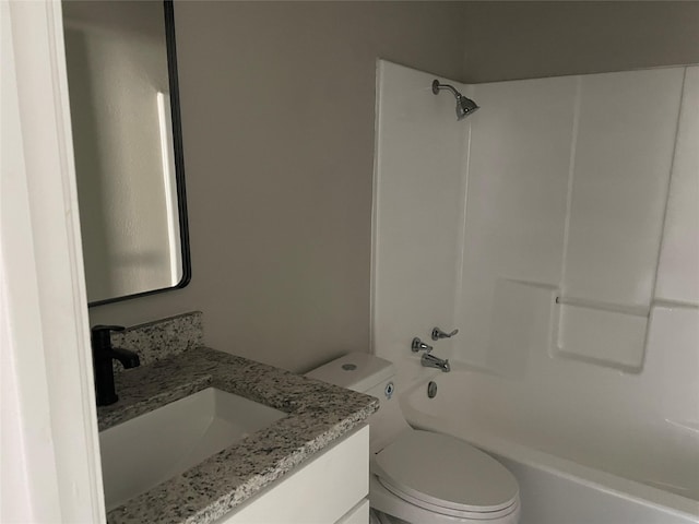 full bathroom with vanity, tub / shower combination, and toilet