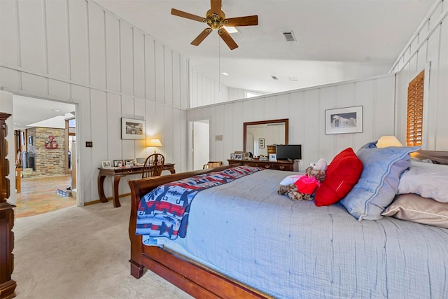 carpeted bedroom featuring high vaulted ceiling and ceiling fan