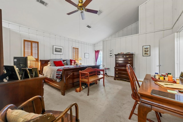 carpeted bedroom featuring ceiling fan and vaulted ceiling