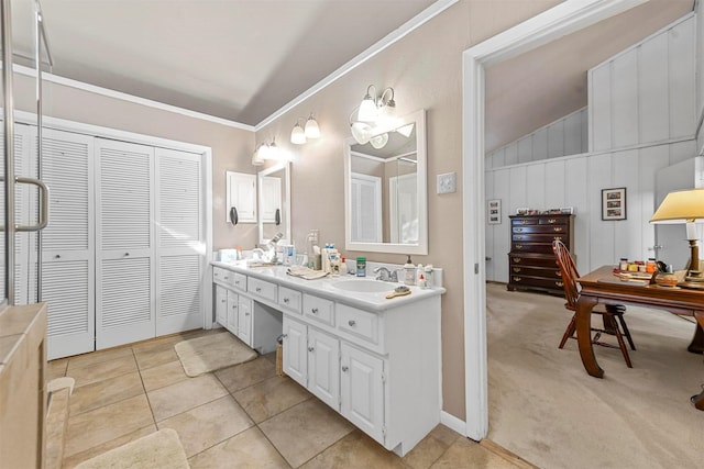 bathroom featuring vanity, lofted ceiling, ornamental molding, and tile patterned floors