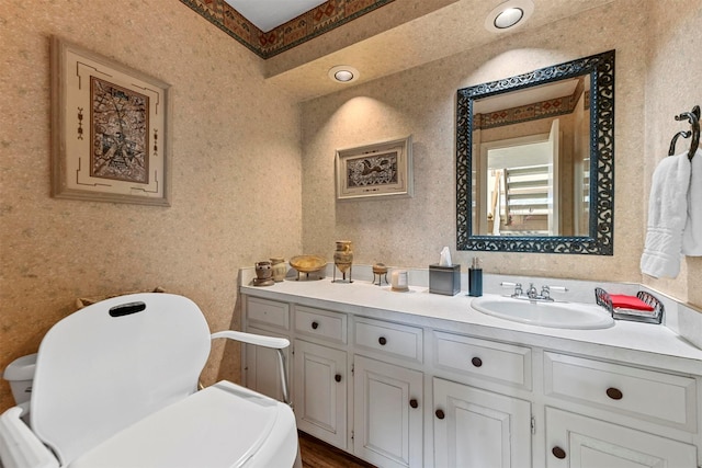 bathroom with vanity and toilet