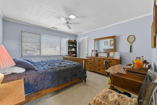 bedroom with crown molding, light colored carpet, ceiling fan, and a textured ceiling