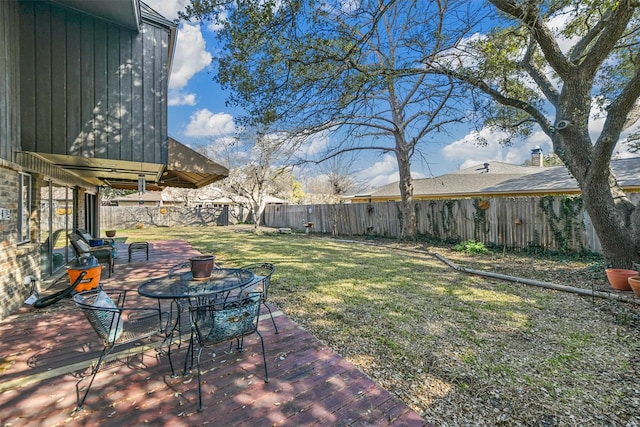 view of yard with a deck