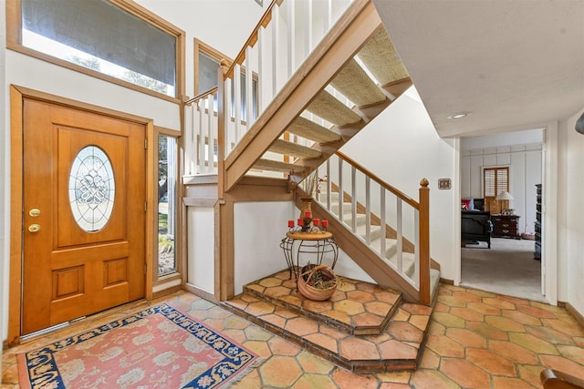 foyer entrance featuring a high ceiling