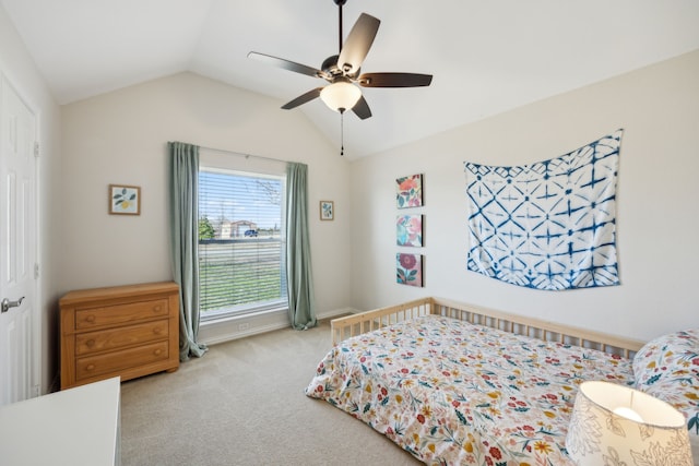 bedroom with ceiling fan, light colored carpet, and lofted ceiling