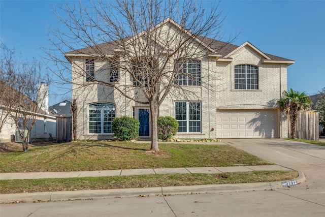 view of front facade featuring a garage and a front yard