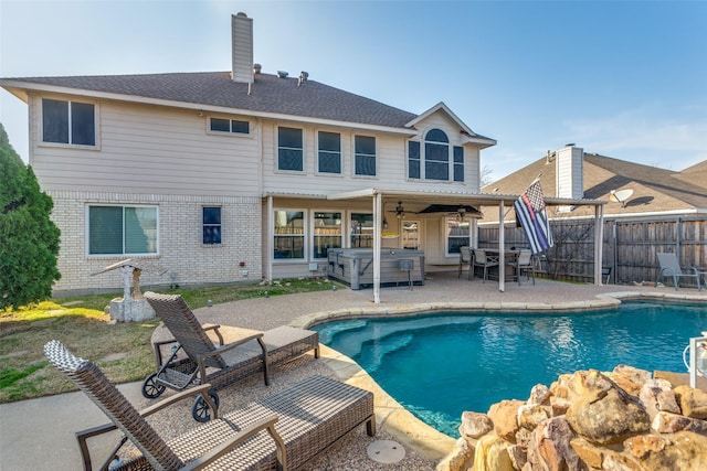 view of pool featuring ceiling fan, a hot tub, and a patio area